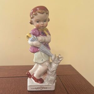Charming Ceramic Figurine with Dog